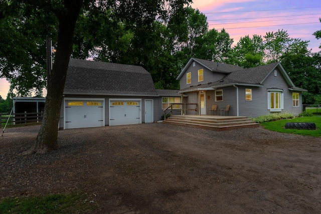 2021 Main St S, Pine City Twp, MN 55063 - view of front of property featuring an outdoor structure, driveway, a garage, and roof with shingles