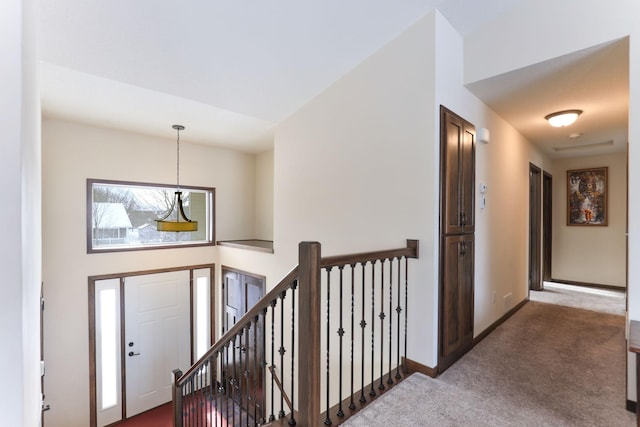 view of carpeted foyer