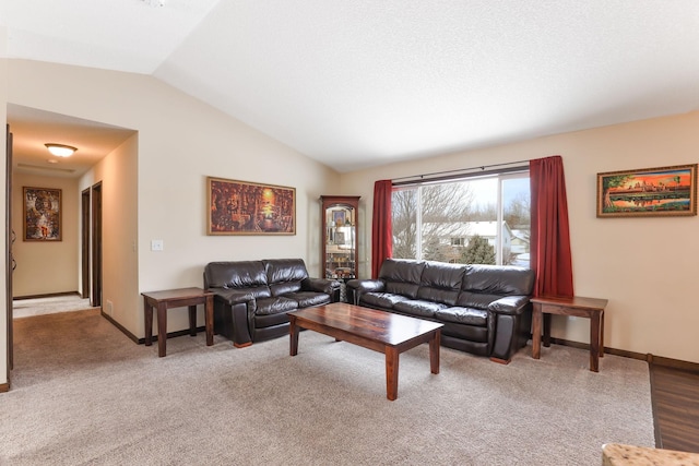 living room with carpet and vaulted ceiling