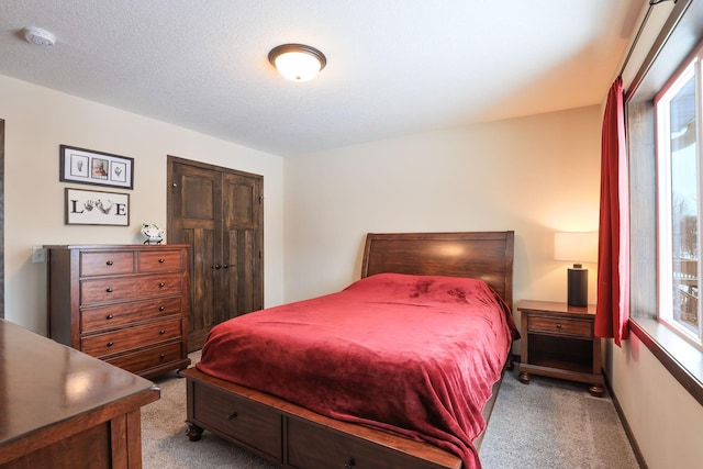 bedroom featuring light carpet