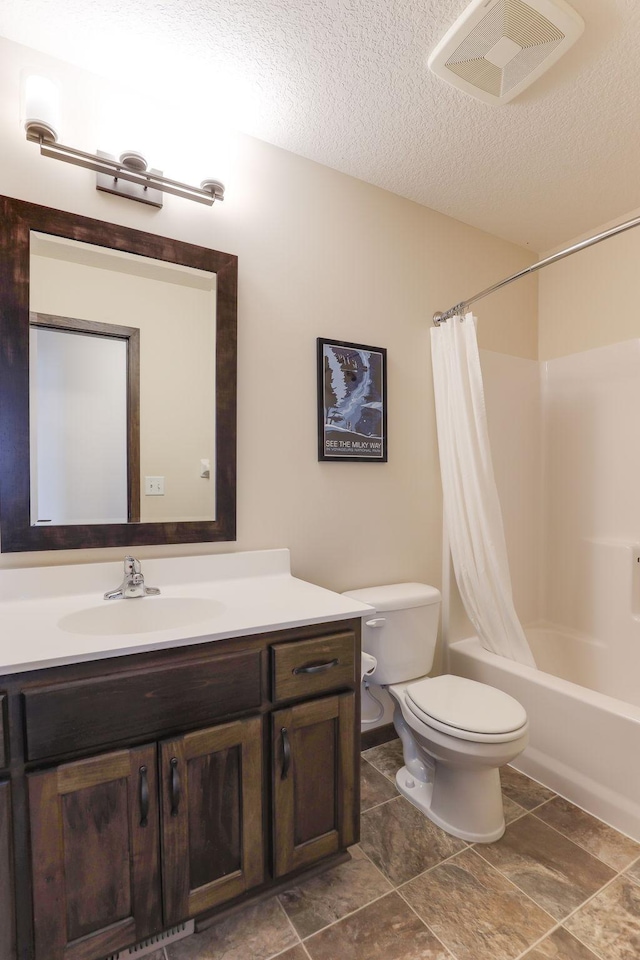 full bathroom with a textured ceiling, toilet, shower / bathtub combination with curtain, and vanity