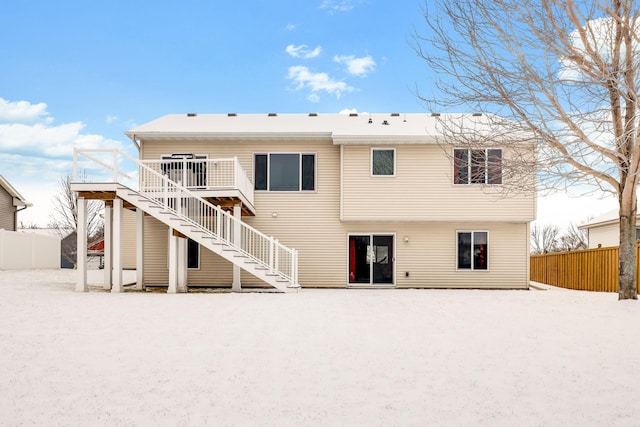 back of property with a wooden deck