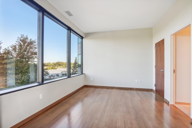 unfurnished room featuring light hardwood / wood-style flooring