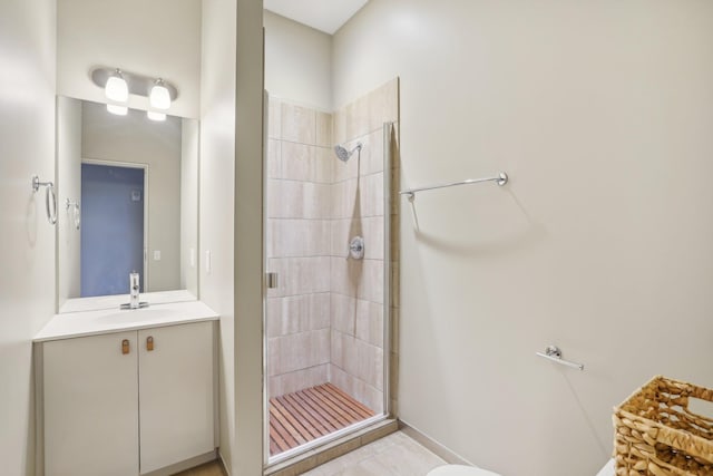 bathroom featuring walk in shower and vanity