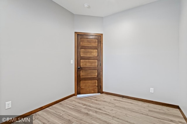 spare room with light hardwood / wood-style floors