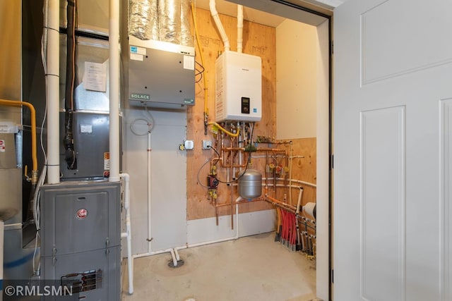 utility room with water heater and heating unit