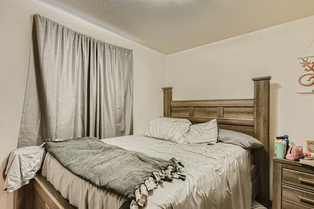 bedroom featuring a textured ceiling