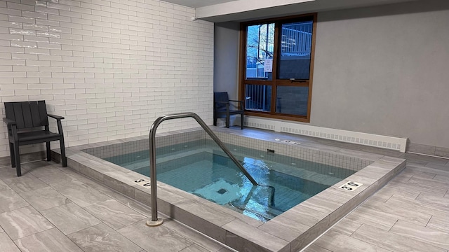 view of pool with an indoor in ground hot tub