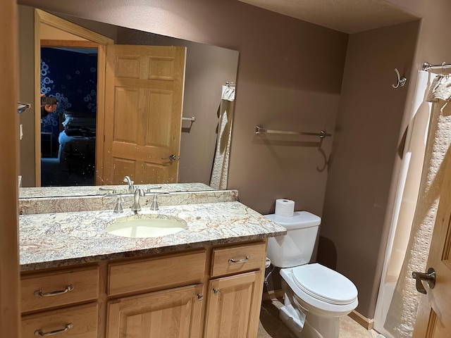 bathroom with vanity, toilet, and a shower with curtain