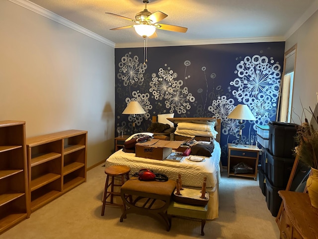 bedroom with a textured ceiling, carpet floors, ceiling fan, and ornamental molding