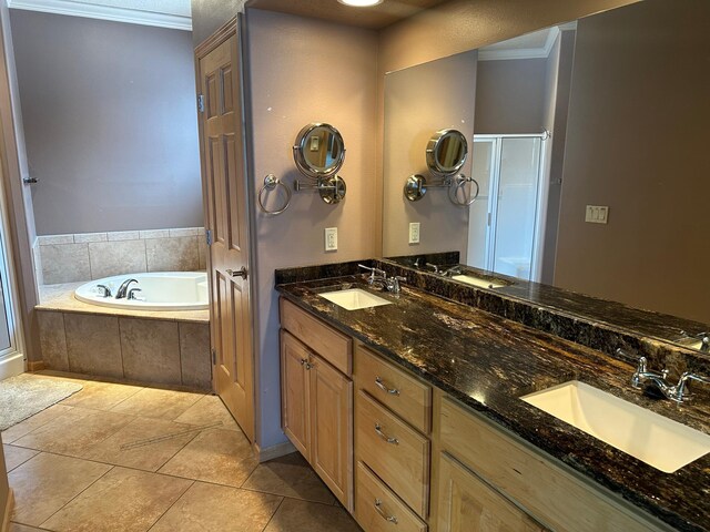 bathroom featuring plus walk in shower, vanity, and ornamental molding