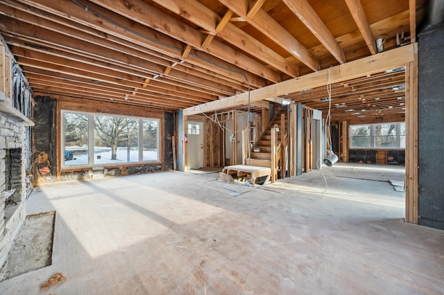 miscellaneous room with a stone fireplace