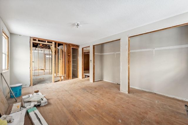 unfurnished bedroom featuring two closets