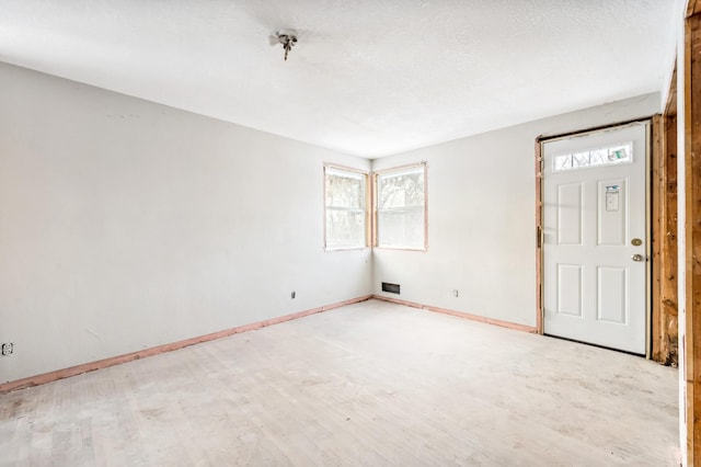 spare room featuring light wood-type flooring