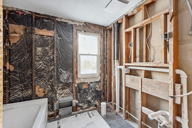 bathroom featuring a textured ceiling