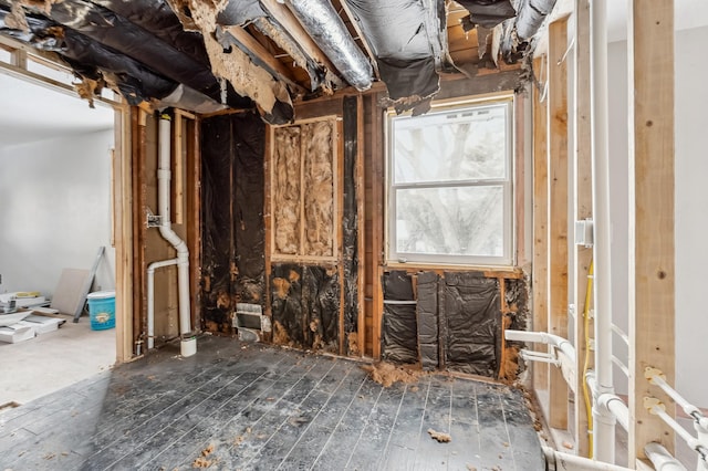 miscellaneous room featuring dark wood-type flooring