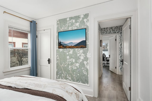 bedroom featuring light hardwood / wood-style floors and multiple windows