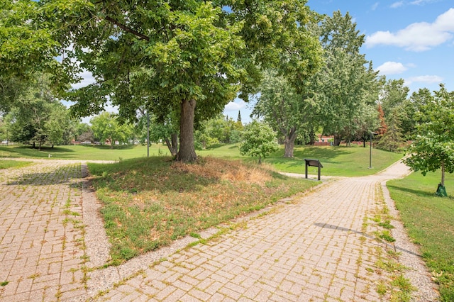 view of home's community featuring a lawn