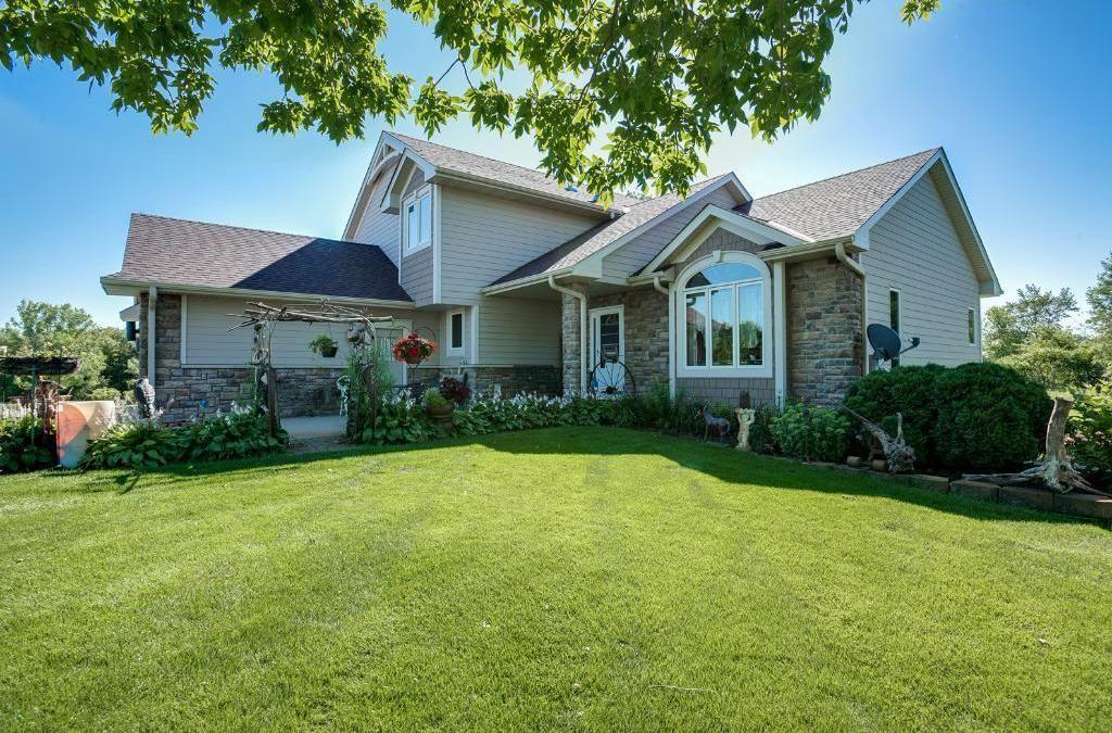 craftsman-style house with a front lawn