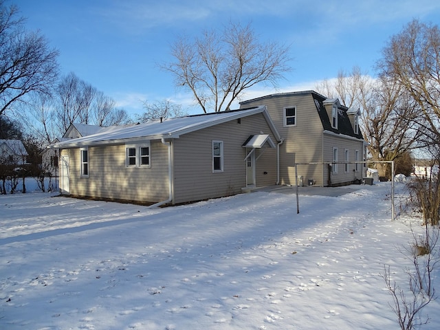 view of snow covered house