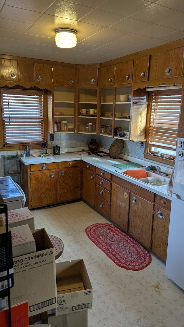 kitchen with sink and white fridge