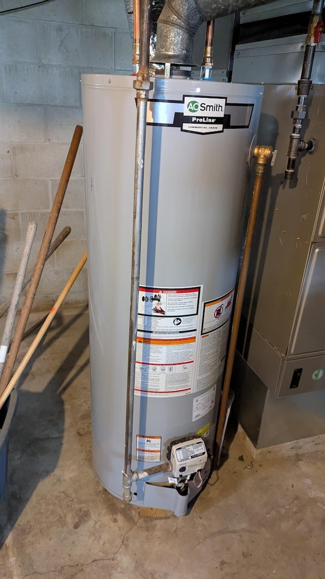 utility room featuring water heater