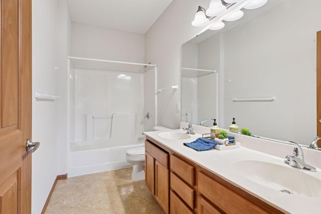 bathroom with double vanity, toilet, a sink, and shower / bathing tub combination