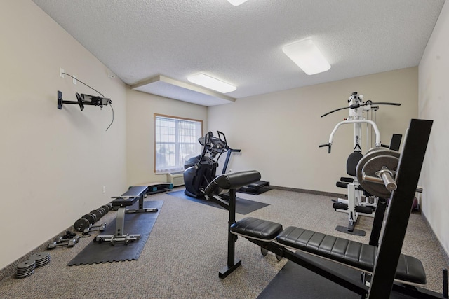 workout area featuring a textured ceiling
