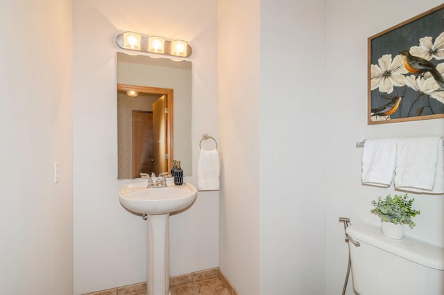 bathroom featuring toilet and tile patterned floors