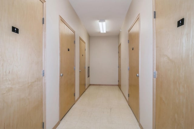 hallway featuring light floors