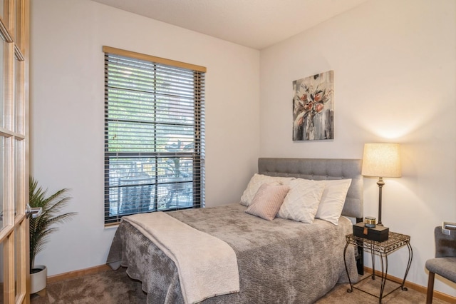 bedroom featuring carpet flooring and baseboards