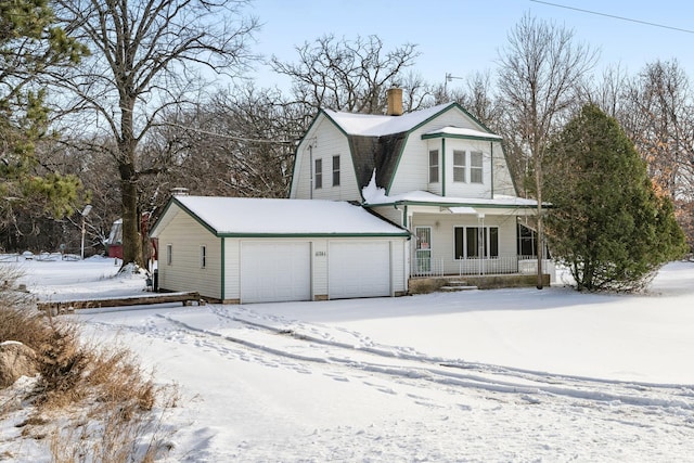 view of front of home featuring covered porch and a garage