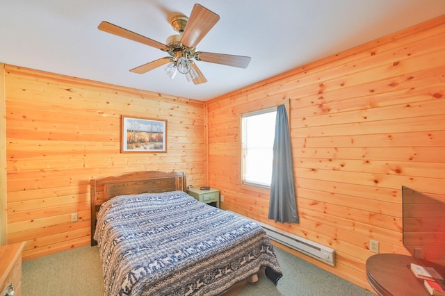 bedroom featuring baseboard heating, ceiling fan, wooden walls, and light carpet