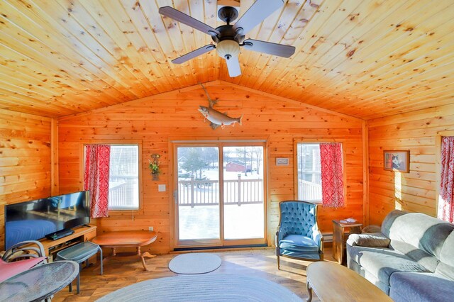 living room with hardwood / wood-style floors, vaulted ceiling, and wooden ceiling