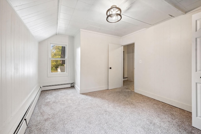 unfurnished bedroom with lofted ceiling, light carpet, and a baseboard heating unit