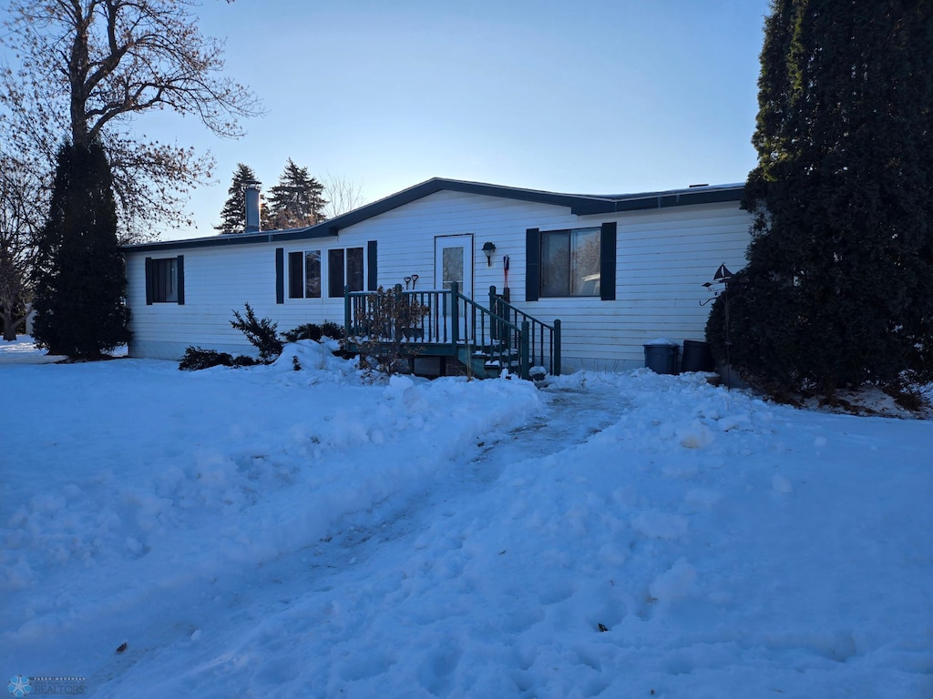 view of front of property with a wooden deck