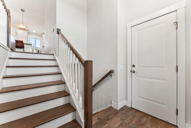 stairs with hardwood / wood-style flooring