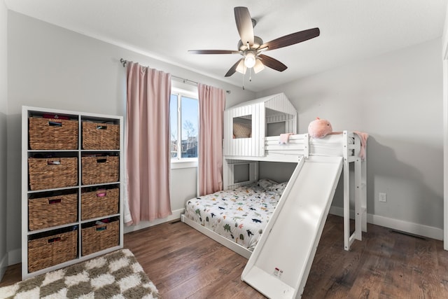 bedroom featuring ceiling fan and dark hardwood / wood-style floors