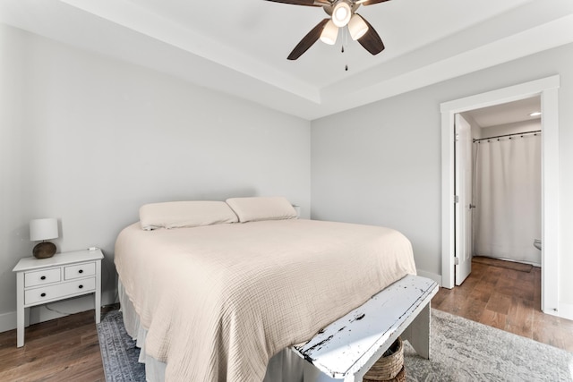 bedroom with ceiling fan and dark hardwood / wood-style floors