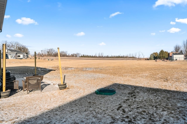 view of yard with a rural view