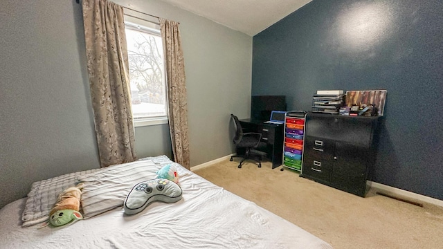 carpeted bedroom featuring vaulted ceiling