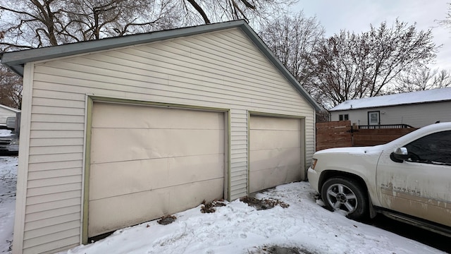 view of snow covered garage