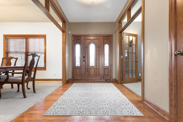 foyer with light hardwood / wood-style flooring and plenty of natural light