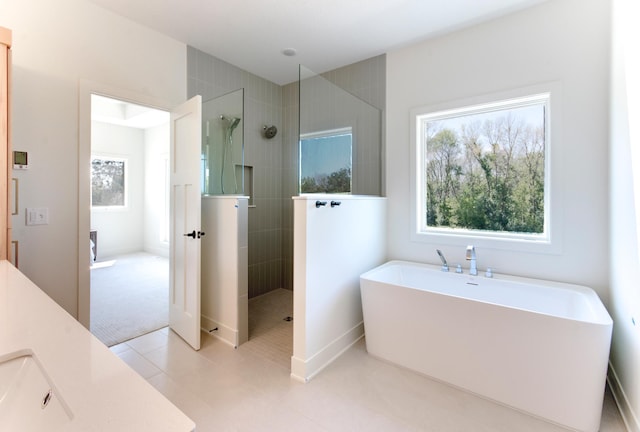 bathroom with vanity, independent shower and bath, and tile patterned flooring