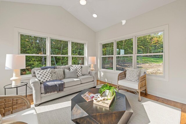 sunroom / solarium featuring vaulted ceiling