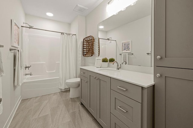 full bathroom with shower / bath combo with shower curtain, toilet, and vanity