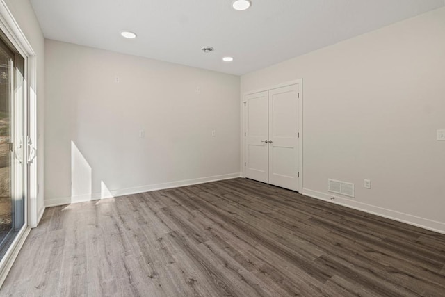 unfurnished room featuring wood-type flooring