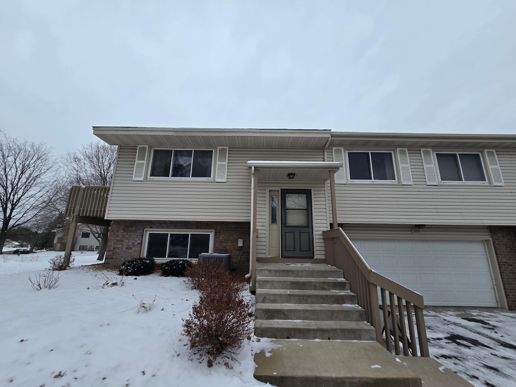 split foyer home featuring a garage