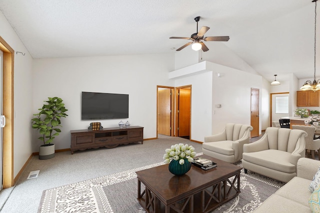 living room featuring ceiling fan, high vaulted ceiling, and carpet