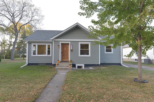 bungalow-style home with a front lawn